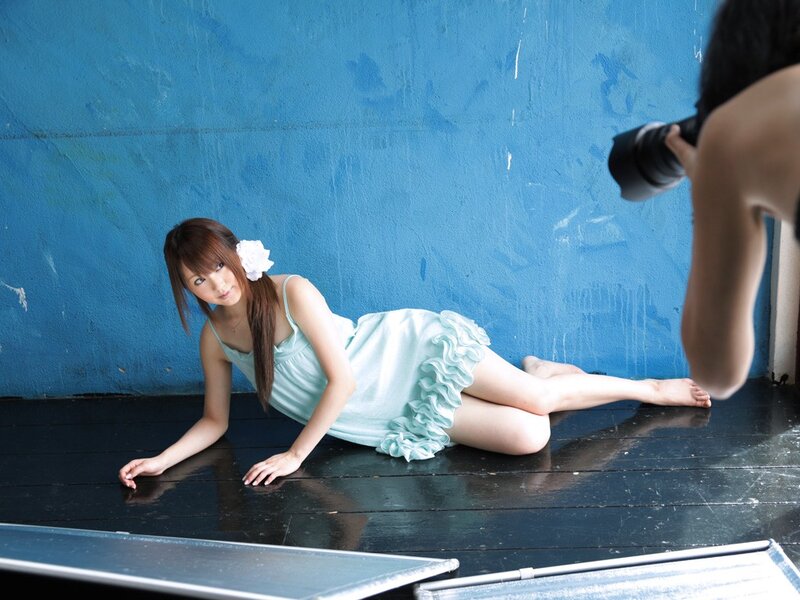 Woman in light blue dress posing