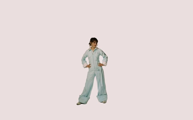 woman in light blue jumpsuit