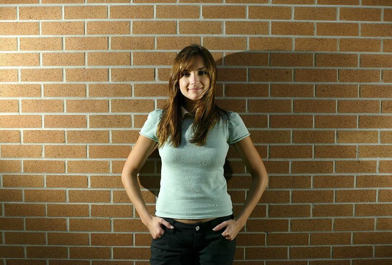 woman in light blue shirt