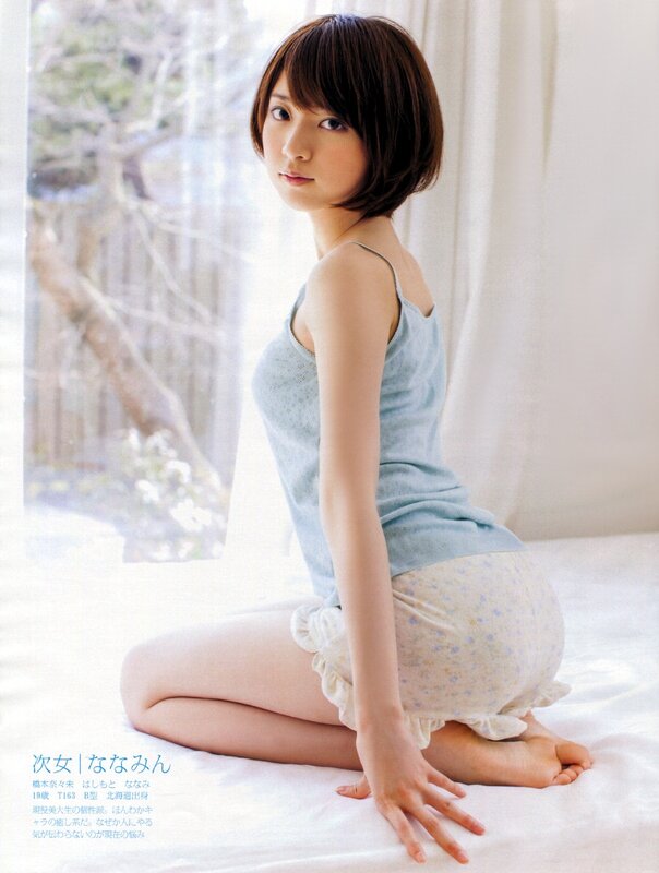 woman in light blue top