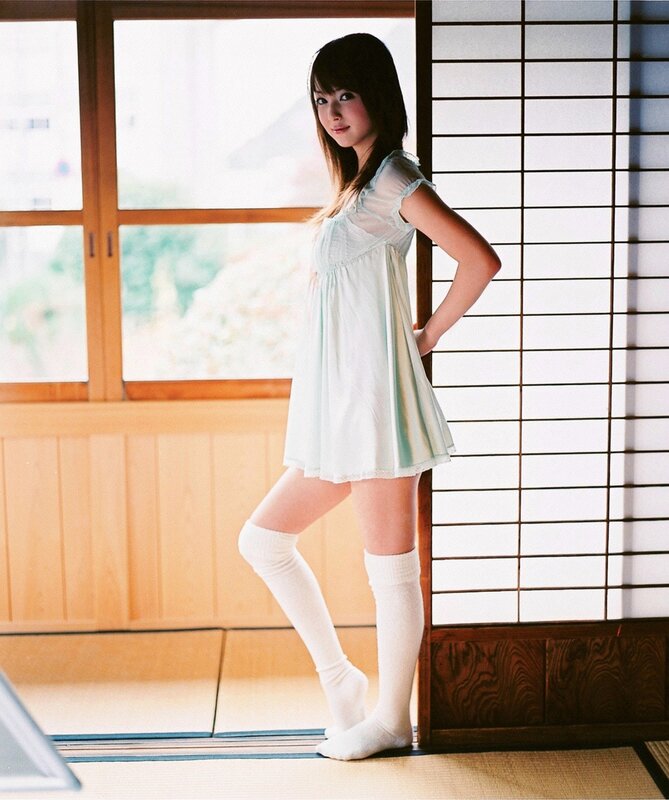 woman in light dress standing