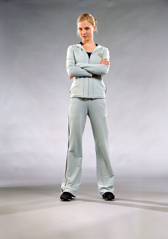 woman in light gray tracksuit