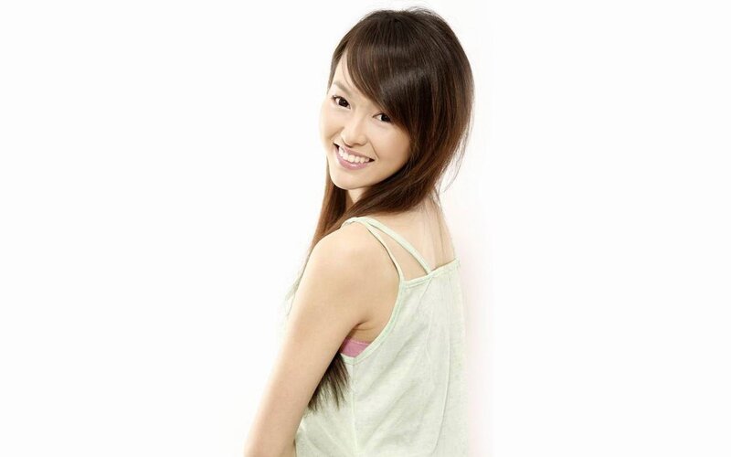 woman in light green top