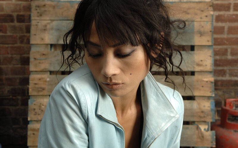 Woman in Light Jacket — Brown