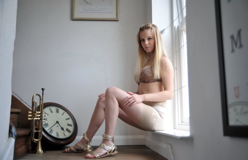 woman in lingerie by window