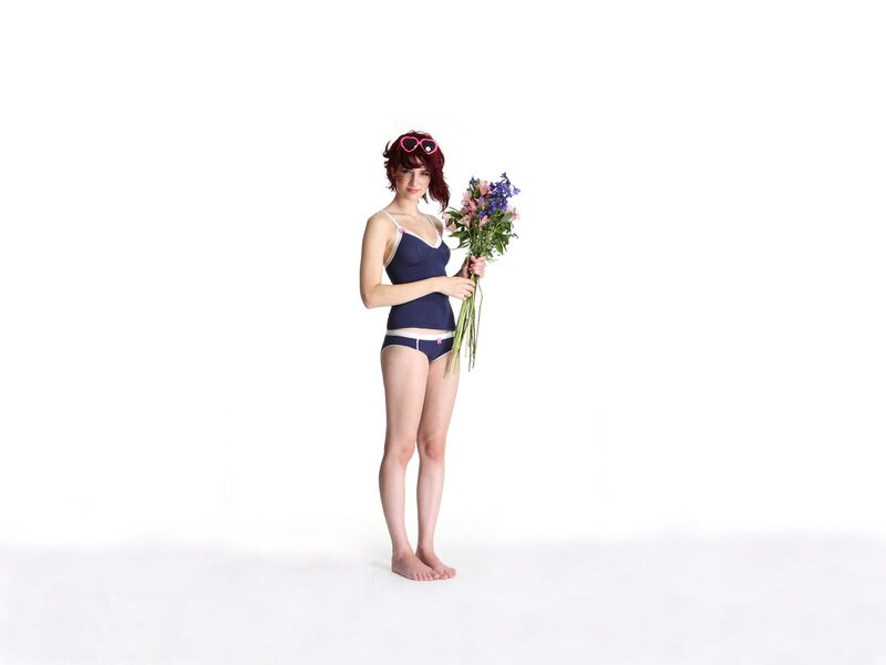 Woman in lingerie holding flowers