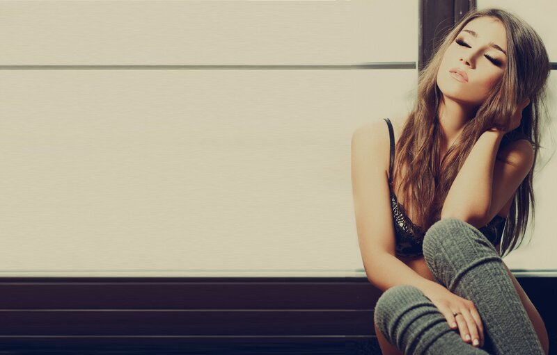 woman in lingerie sitting on floor