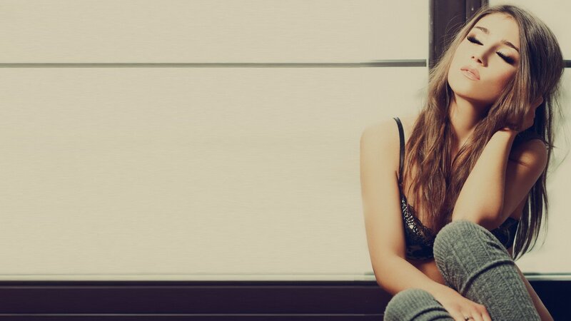 woman in lingerie sitting on floor