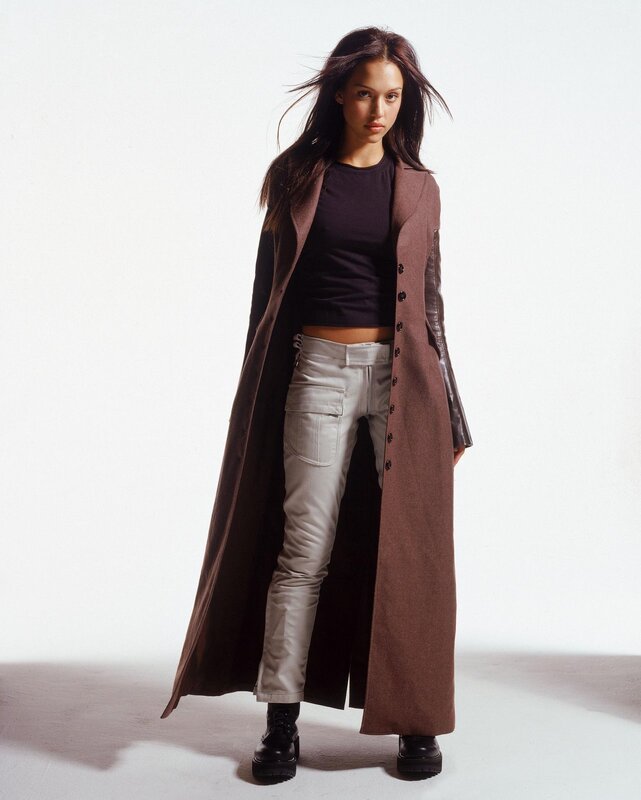 woman in long coat and cargo pants