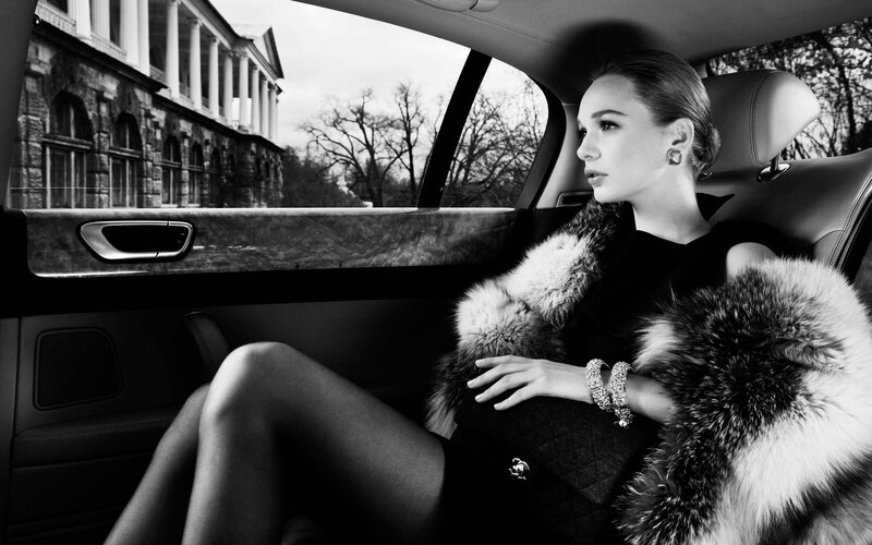woman in luxury car