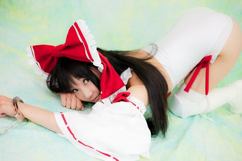 woman in maid costume lying down