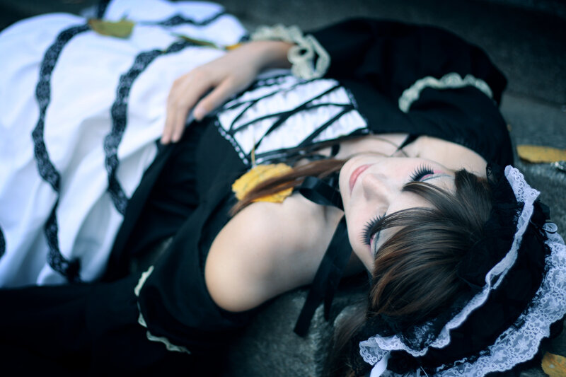 woman in maid costume lying down