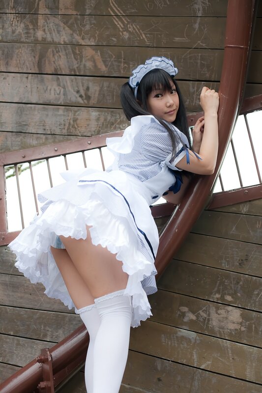 woman in maid costume on stairs