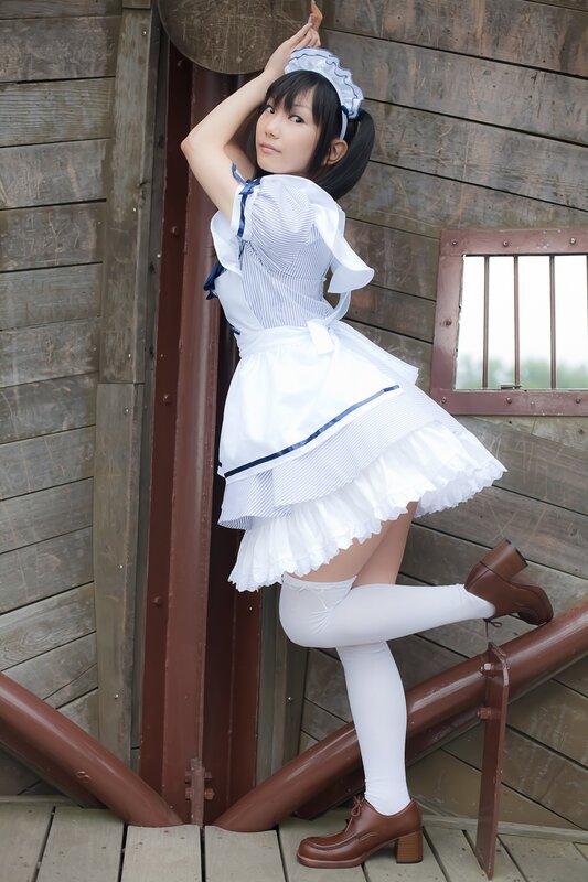 woman in maid costume posing