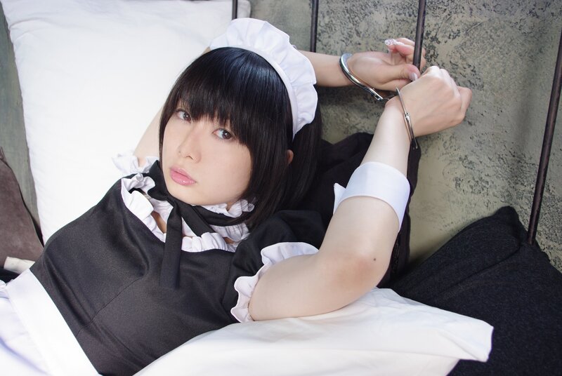 woman in maid costume restrained
