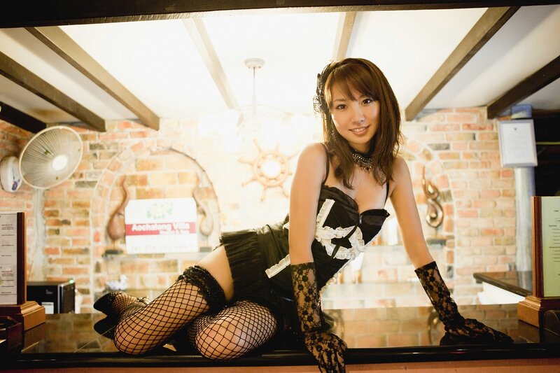 woman in maid outfit at bar