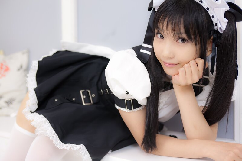 woman in maid outfit posing