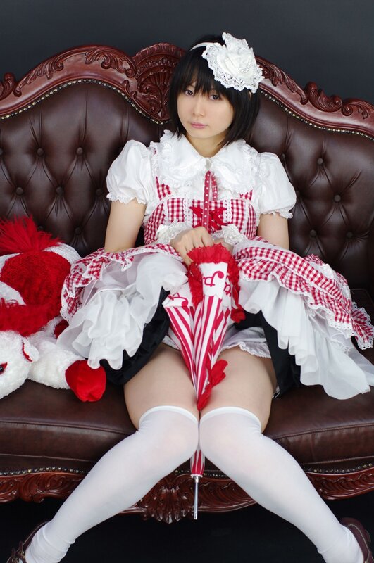 woman in maid outfit sitting