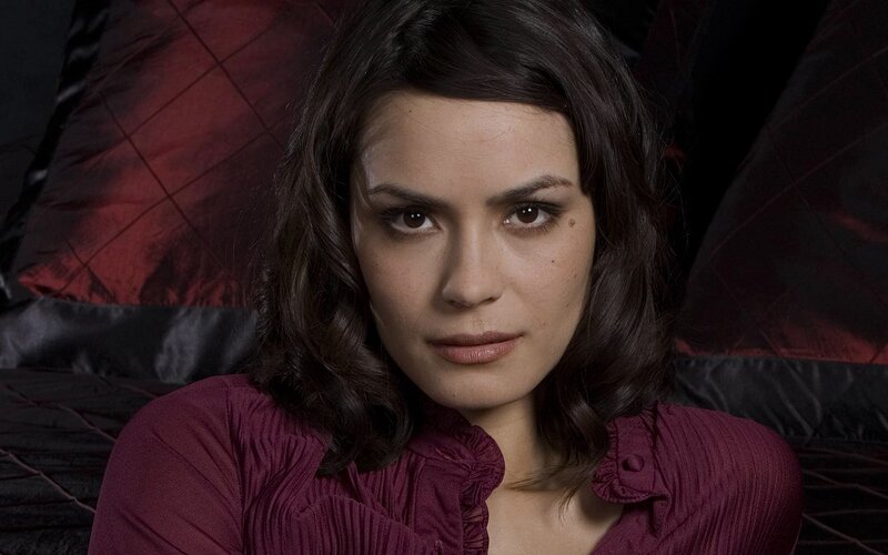 woman in maroon blouse