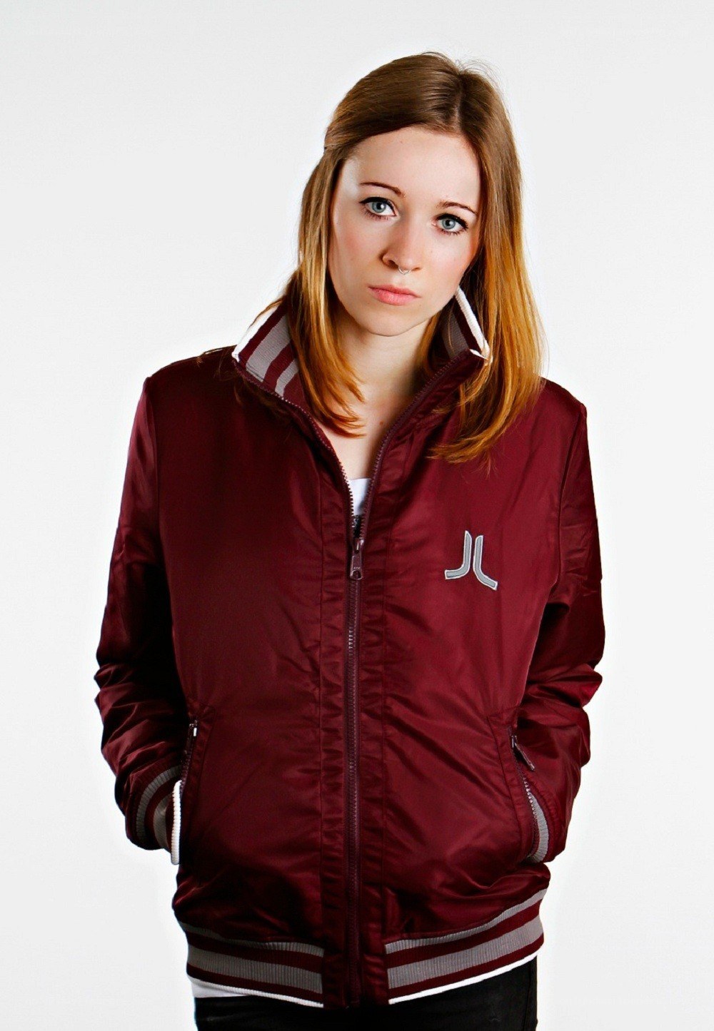 woman in maroon bomber jacket