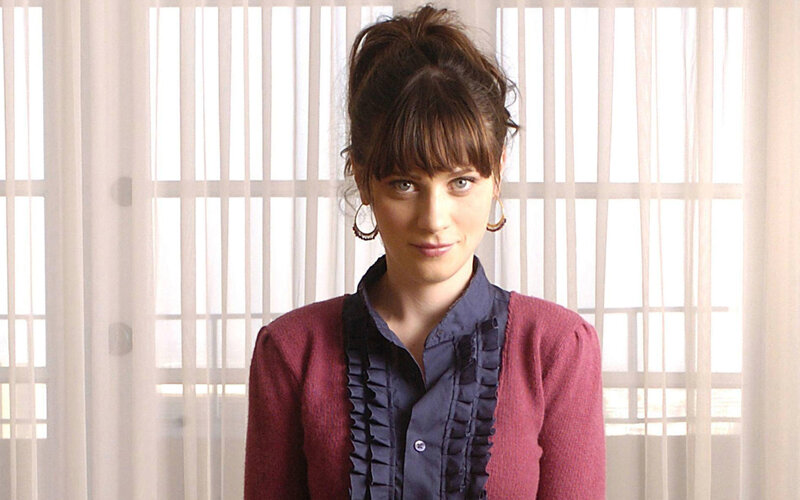 woman in maroon cardigan