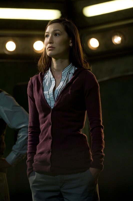 woman in maroon cardigan