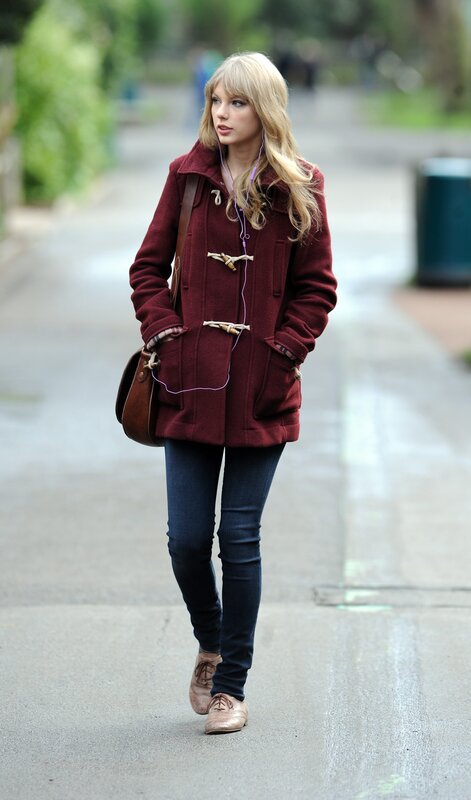 woman in maroon coat walking