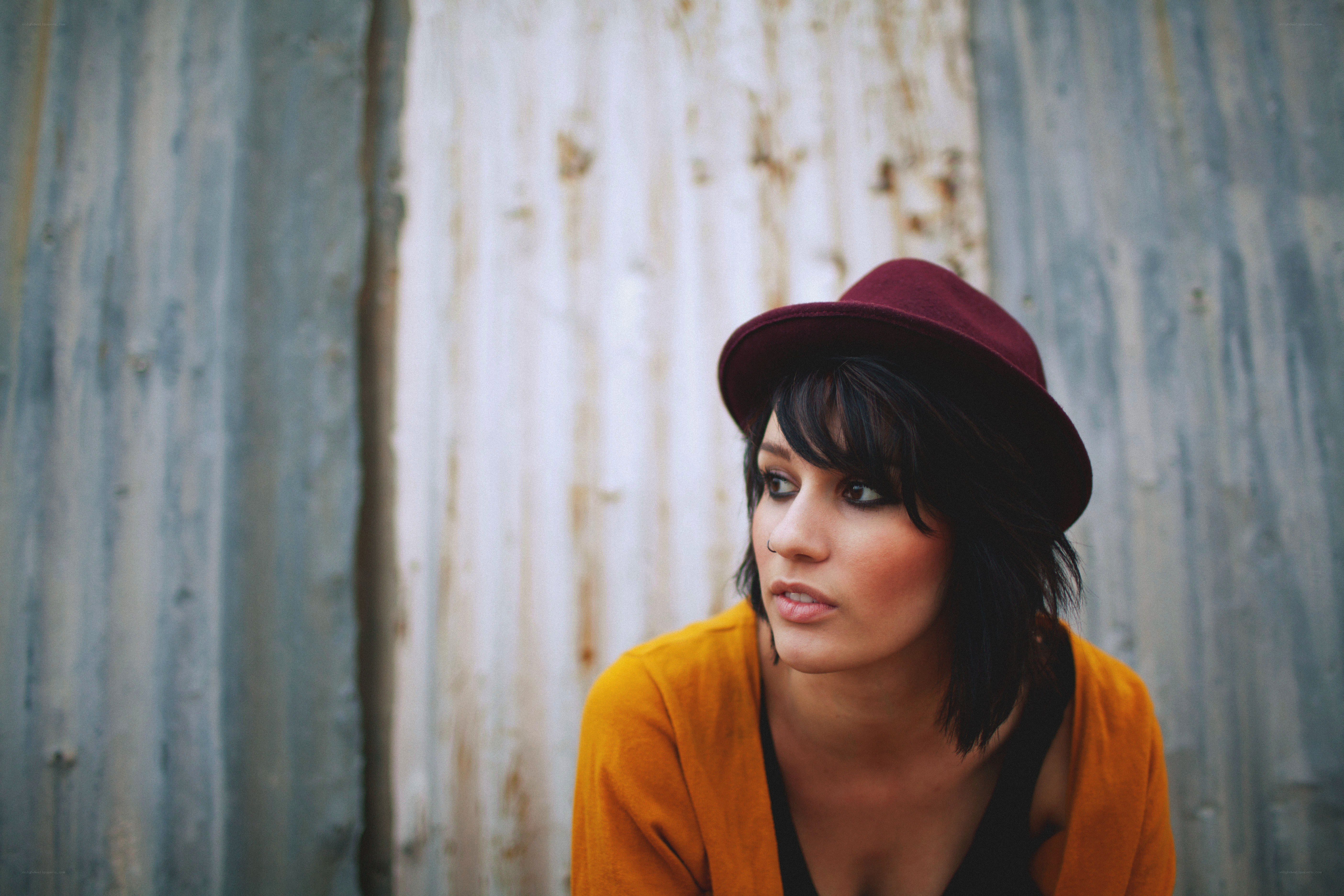 woman in maroon hat