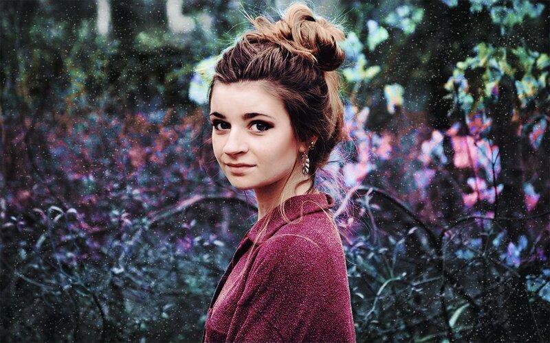 woman in maroon jacket outdoors