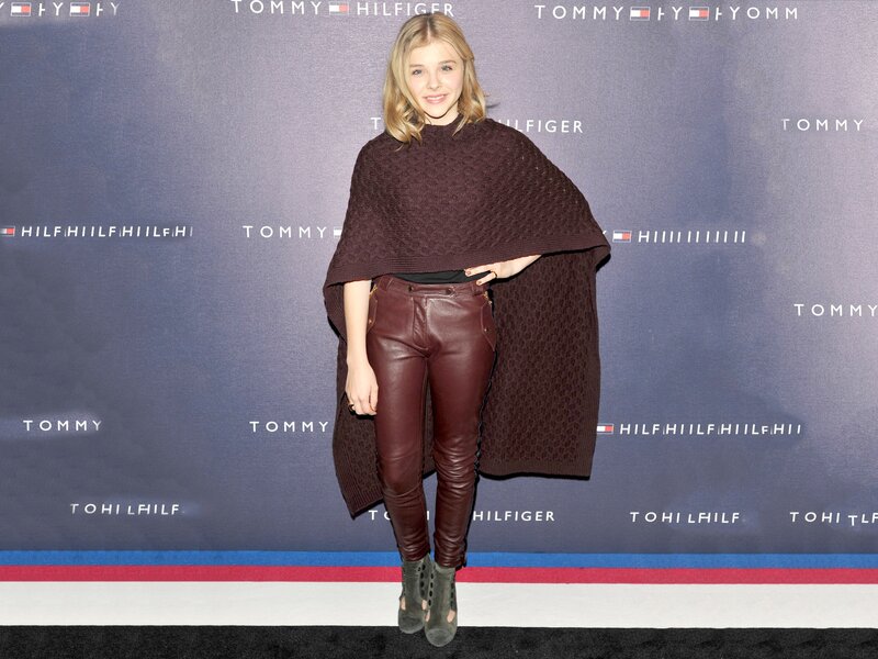 woman in maroon outfit at event