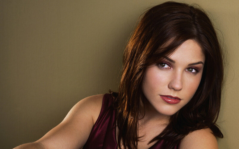 woman in maroon top