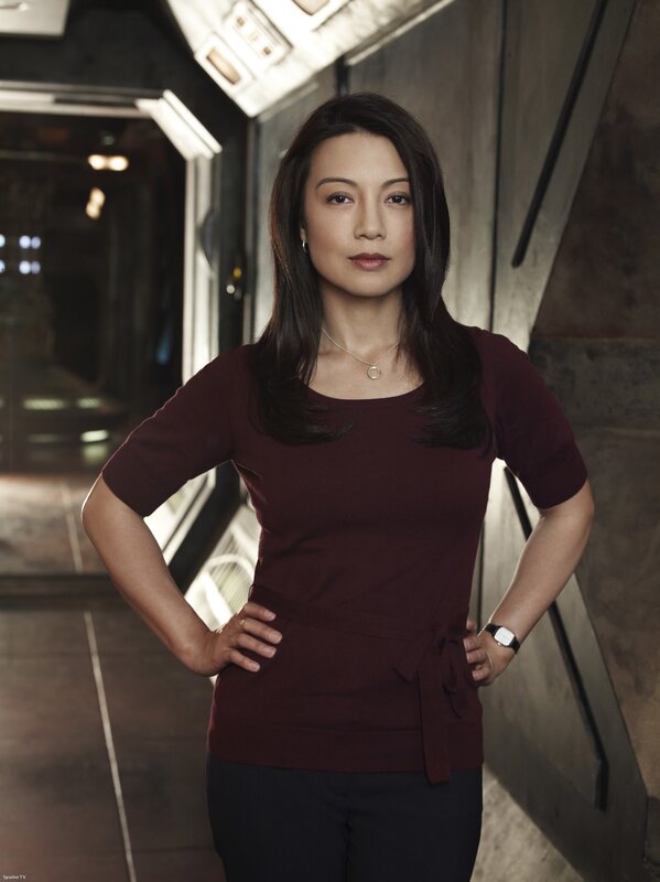 woman in maroon top