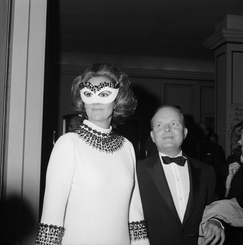Woman in mask with man at event