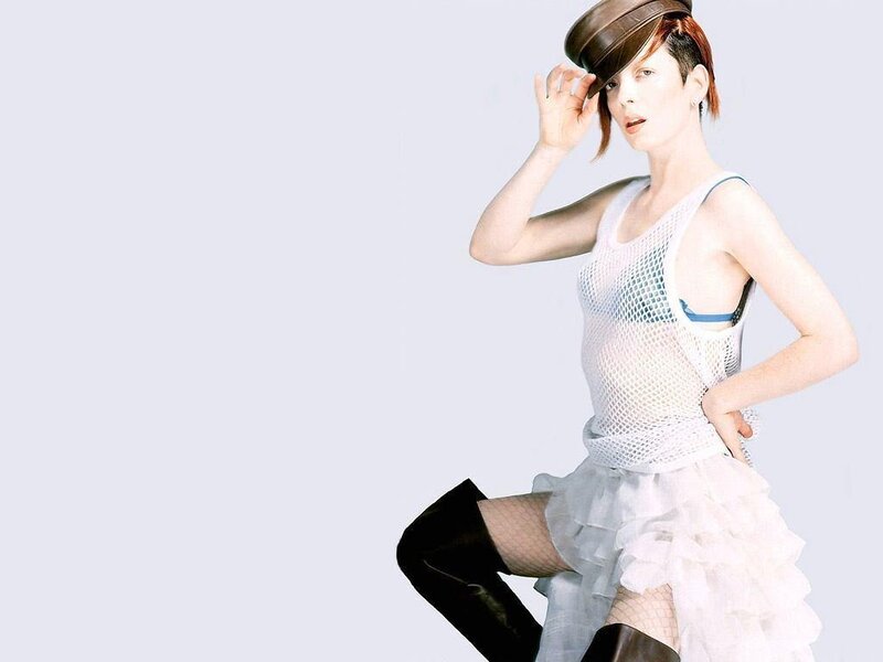 woman in mesh top and hat