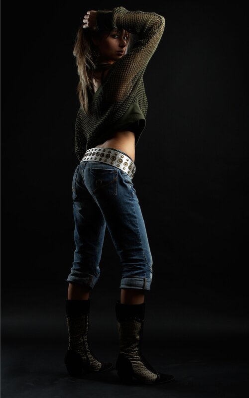 woman in mesh top and jeans
