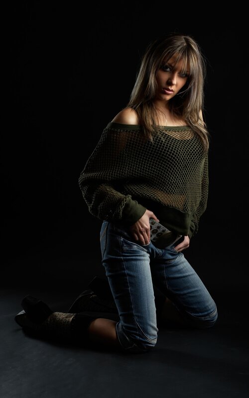 woman in mesh top kneeling