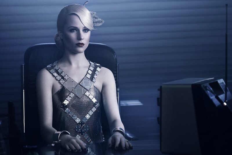 woman in metallic dress sitting