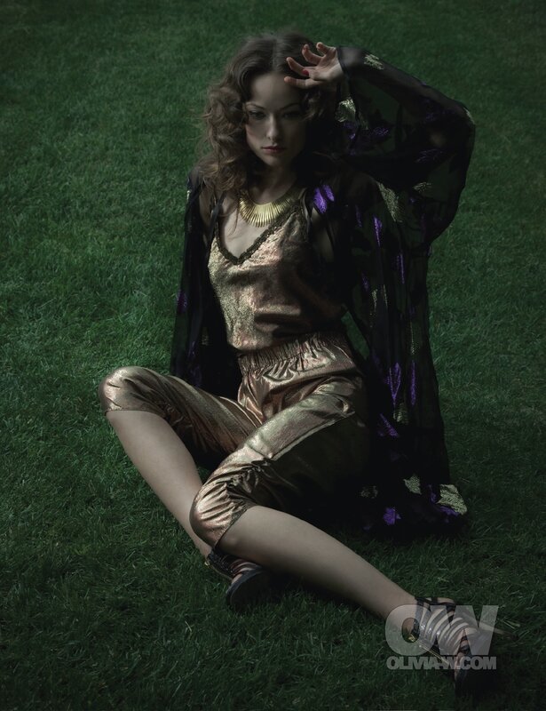 woman in metallic outfit on grass