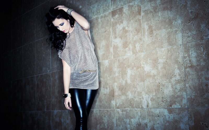 woman in metallic top and leather pants