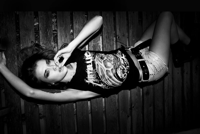 woman in metallica shirt lying down