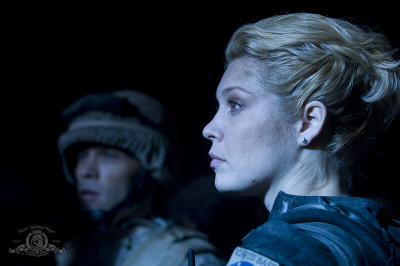 woman in military gear looking forward