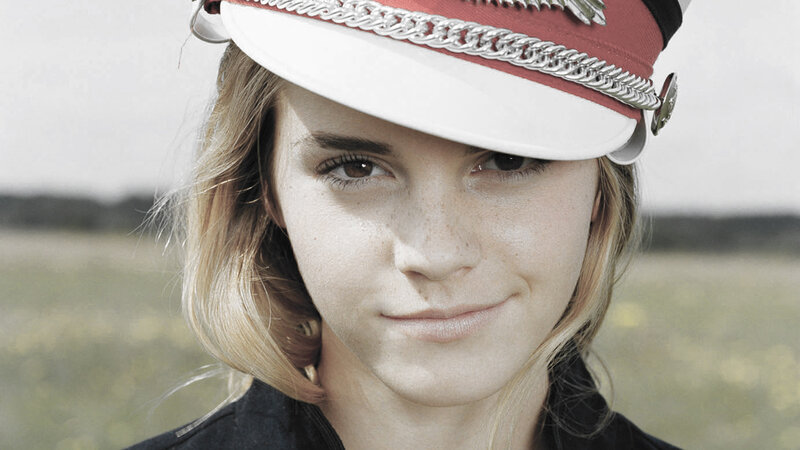 woman in military-style hat