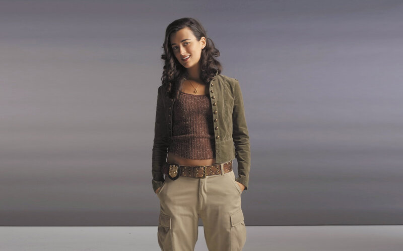woman in military-style jacket