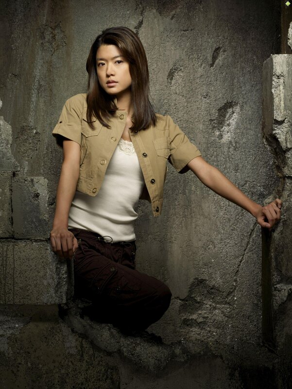 woman in military-style jacket