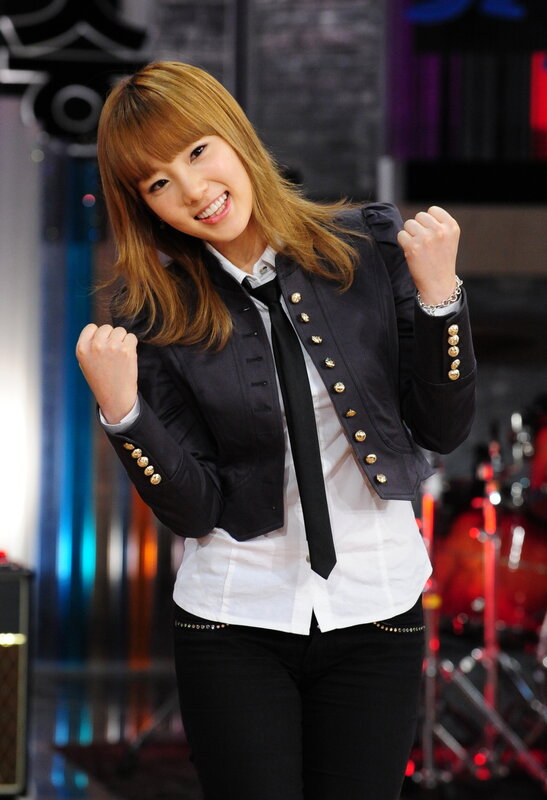 woman in military-style jacket