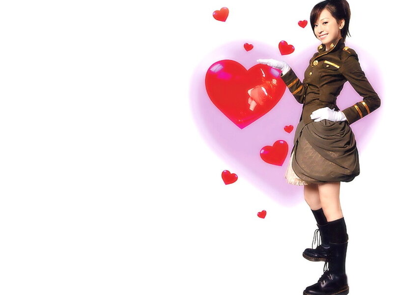 woman in military-style outfit with hearts