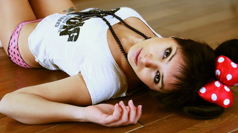 woman in minnie mouse ears lying on floor