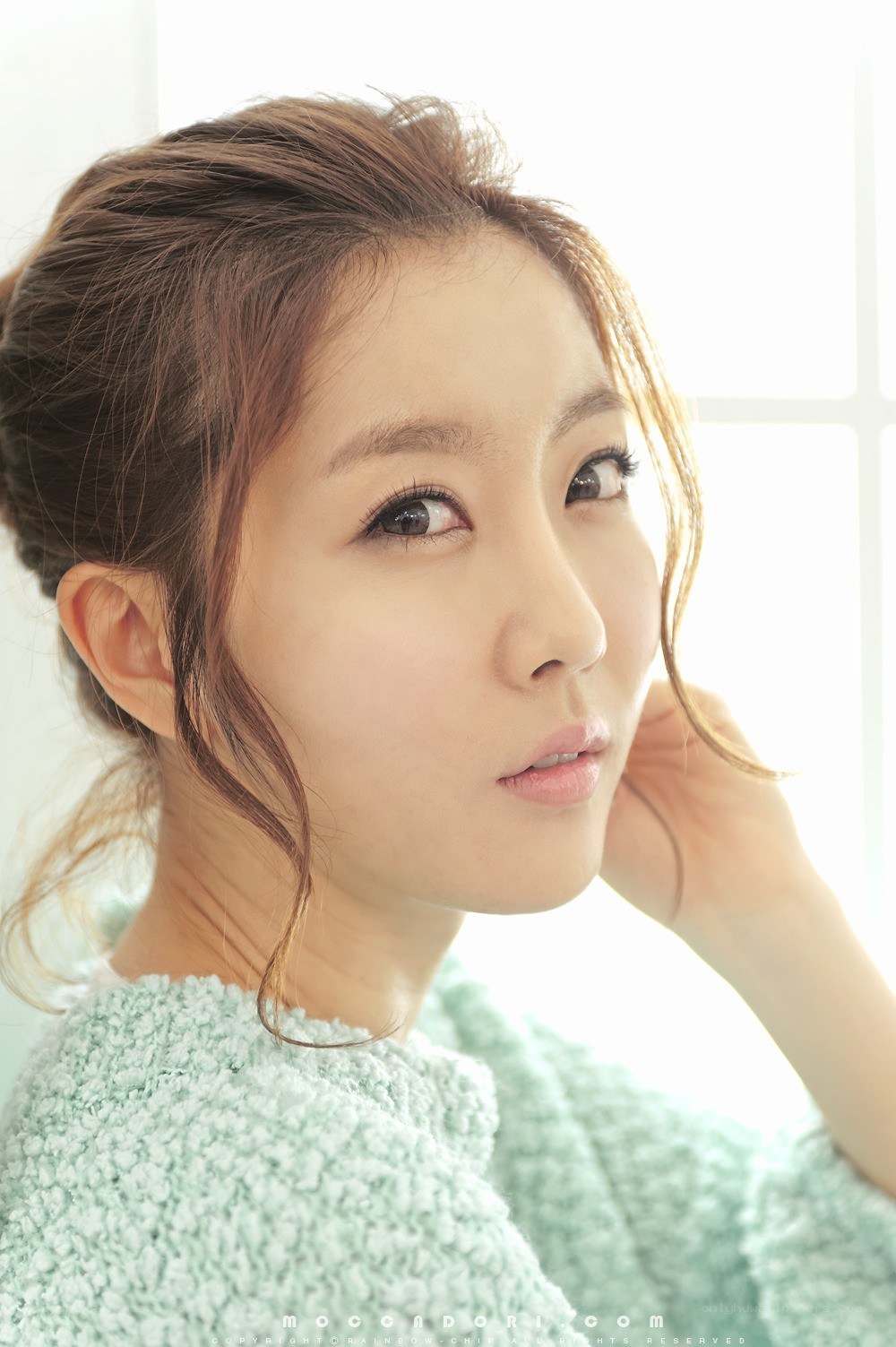 woman in mint sweater