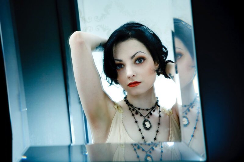 woman in mirror with red lipstick