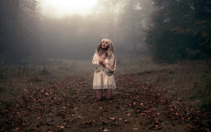 woman in misty forest